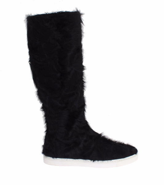 Botas planas elegantes de piel de color negro
