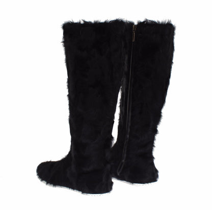 Botas planas elegantes de piel de color negro