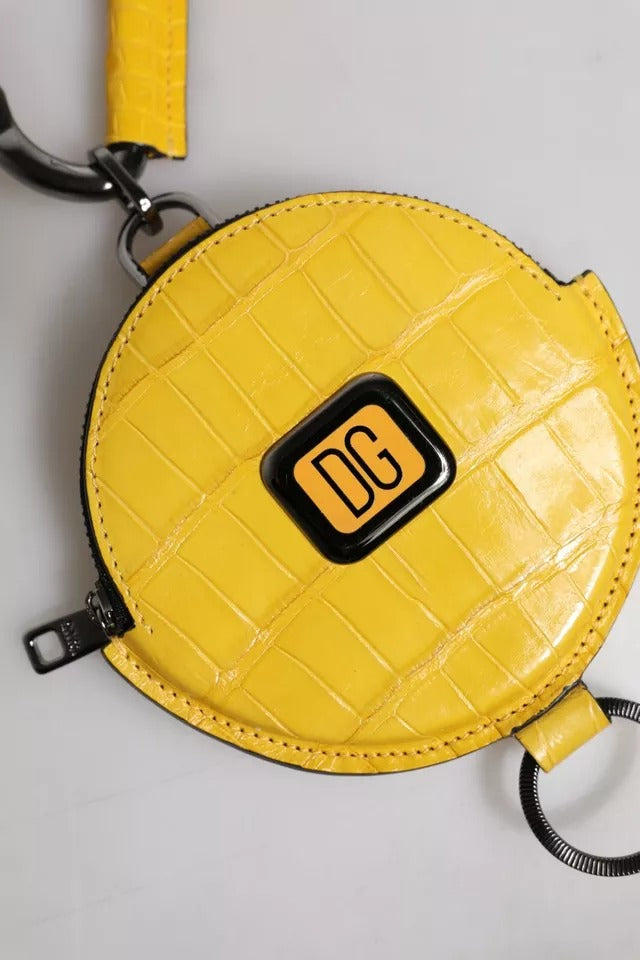 Monedero redondo de cuero amarillo con logotipo de DG y cordón