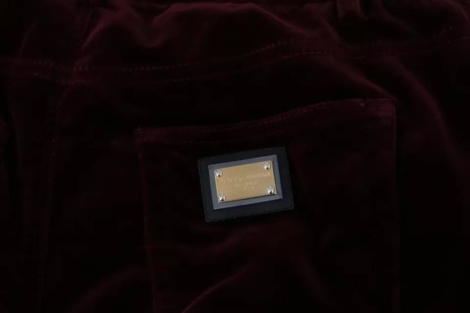 Pantalones ajustados elásticos de terciopelo burdeos