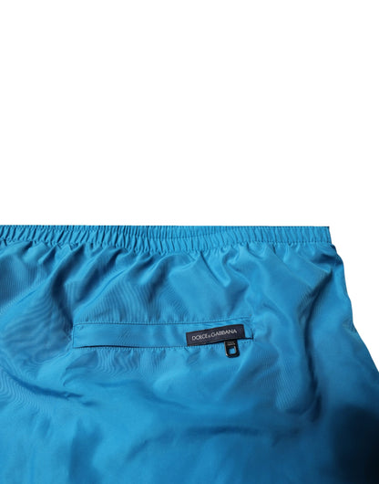 Traje de baño de dos piezas con shorts de playa y logo turquesa