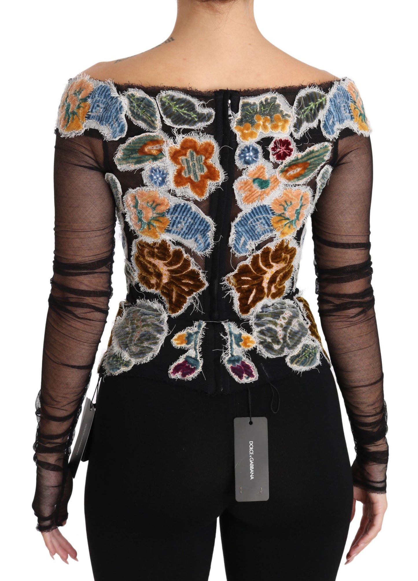 Elegante blusa de manga larga con apliques florales