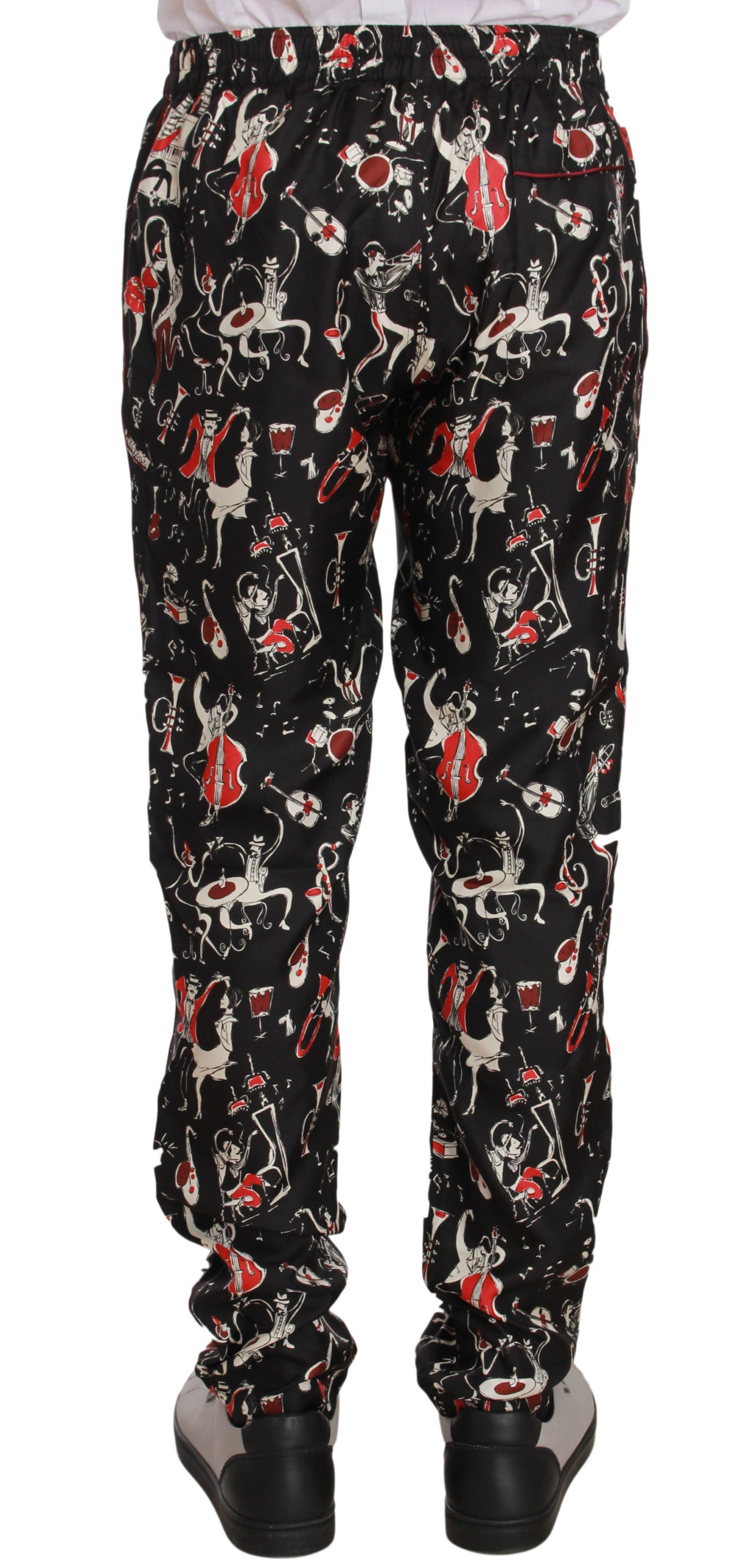 Elegantes pantalones de salón de seda negra con estampado rojo